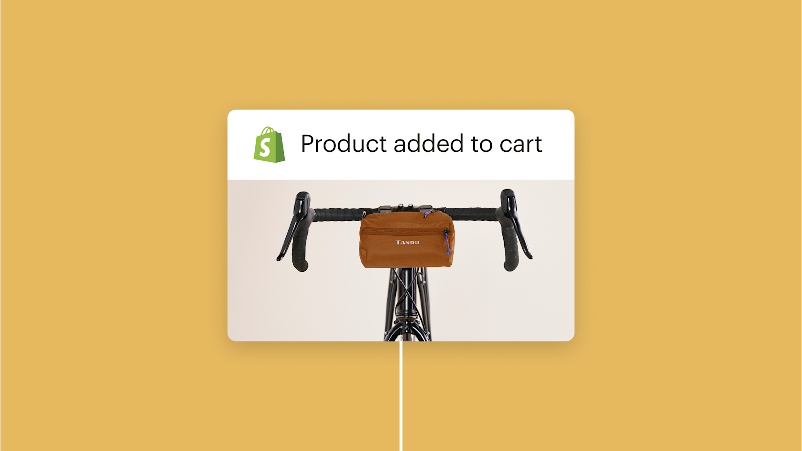 Brown handlebar bag mounted on black bicycle handlebars with Shopify logo and "Product added to cart" text above